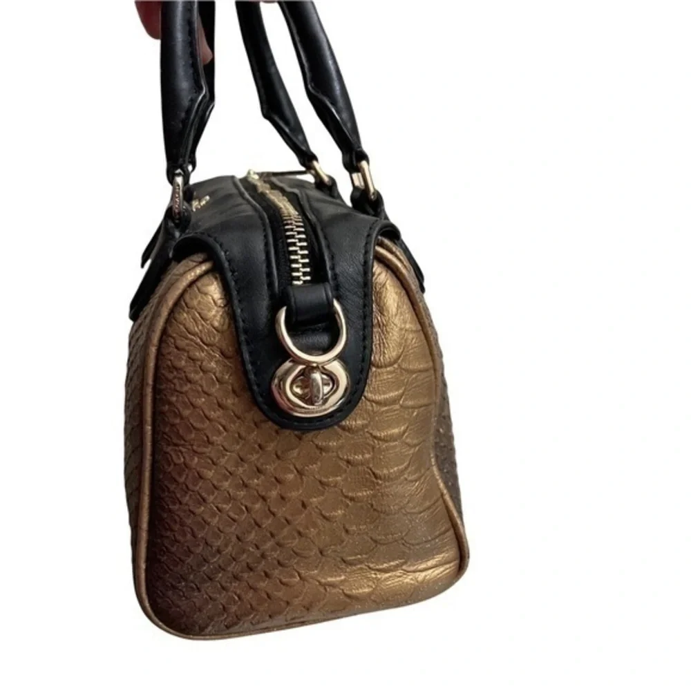 Coach gold embossed leather mini barrel bag
